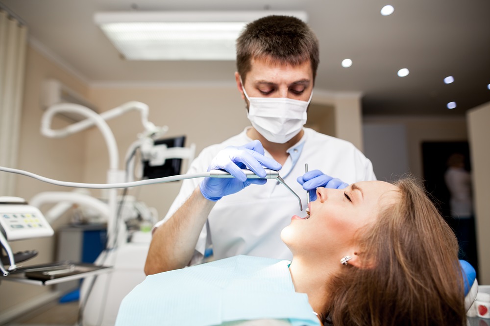 dentist doing root canal treatment